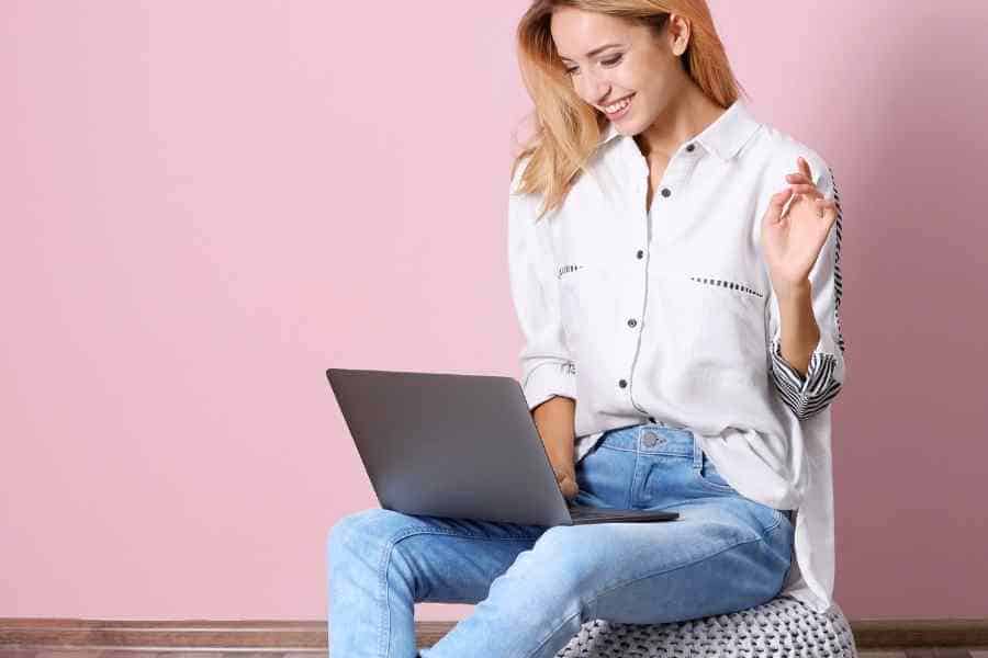 woman writing on a laptop