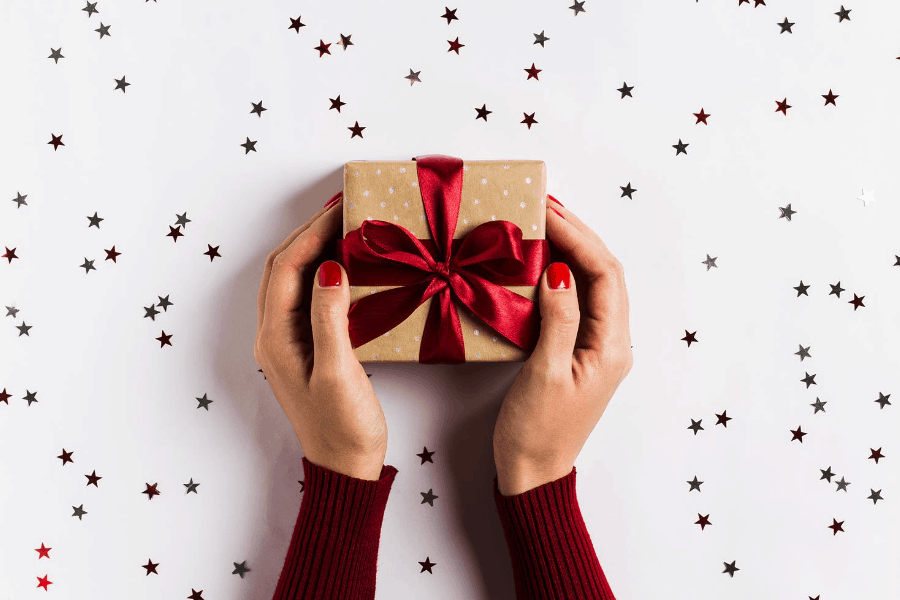 woman holding a christmas gift