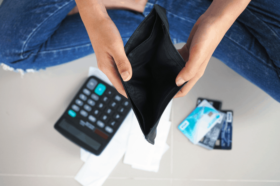 woman holding an empty wallet