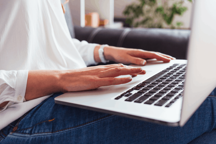 woman typing on a laptop