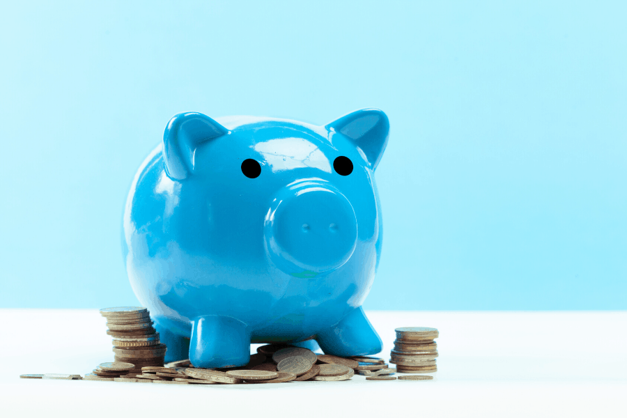 blue piggy bank with coins