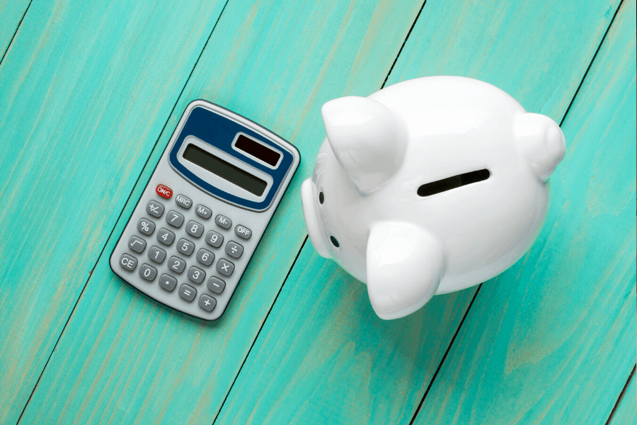 white piggy bank and calculator