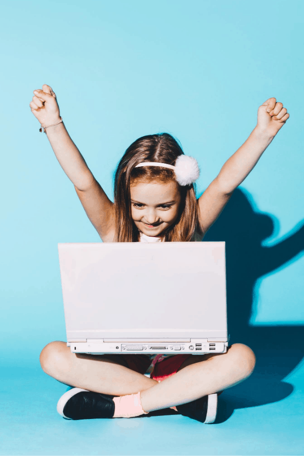 girl homeschooling on a laptop