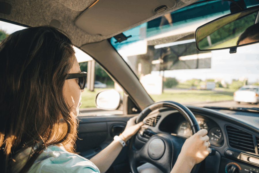 woman driving to make money