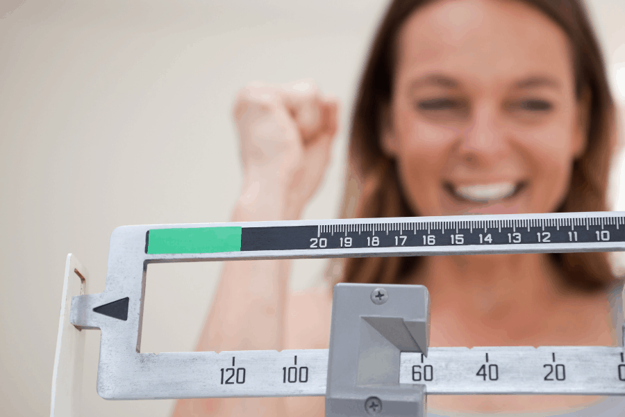 woman celebrating weight loss success