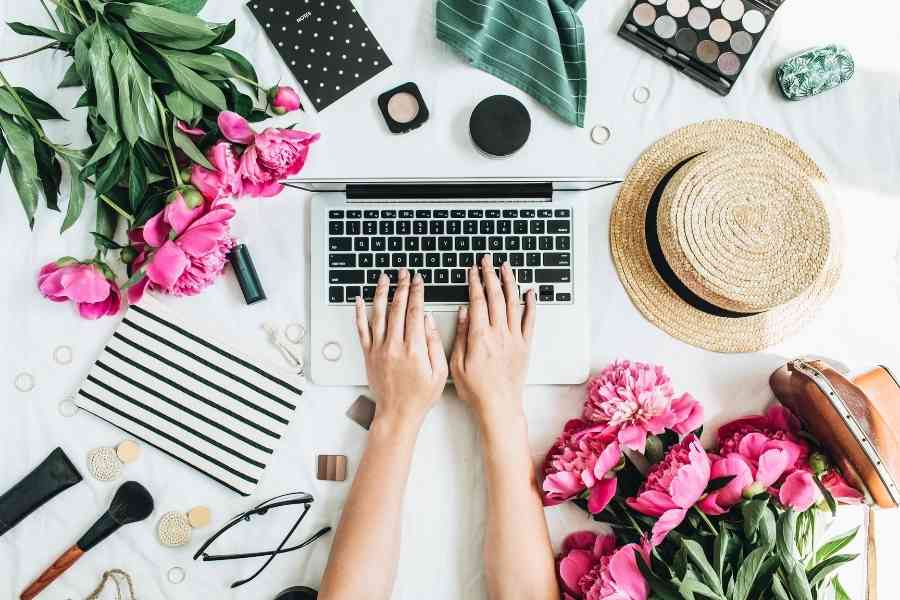 woman typing on a laptop