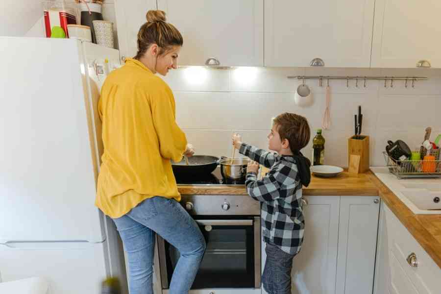 mom and child cooking dinner