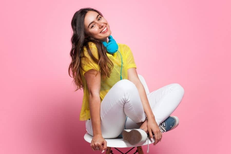 teenager sitting on a stool