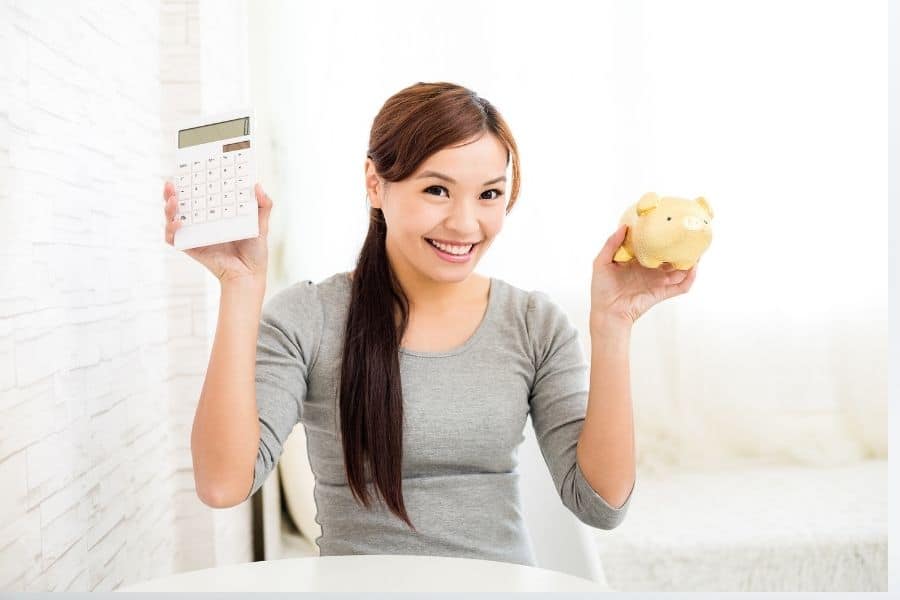 woman holding a piggy bank