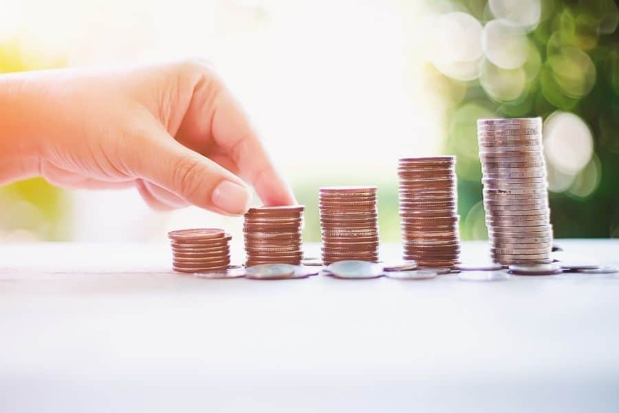 woman stacking coins