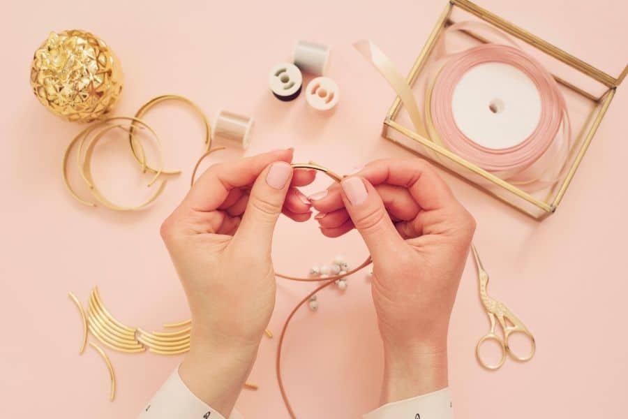 woman making jewelry to sell