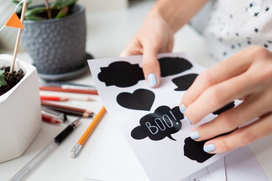 woman making handmade stickers to sell