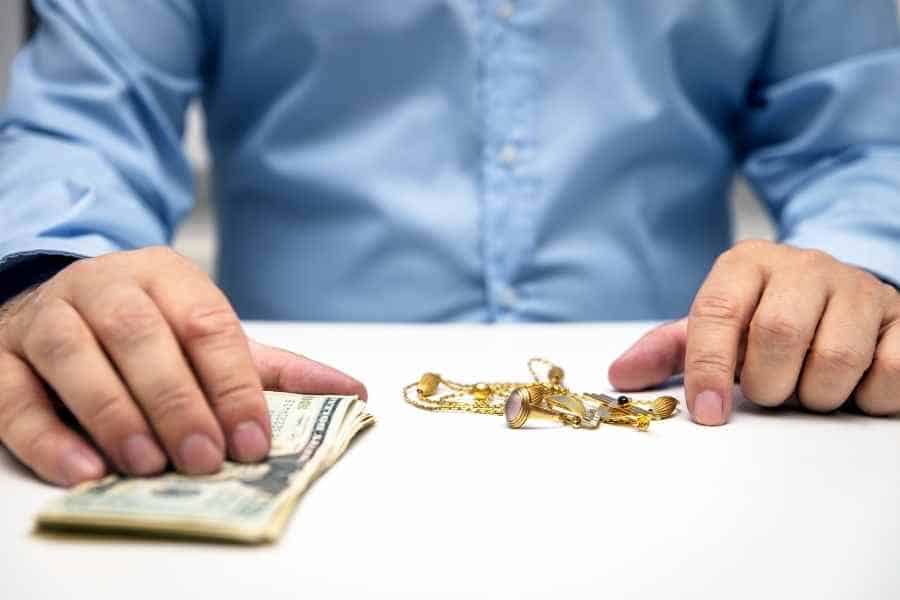 person getting cash at a pawn shop