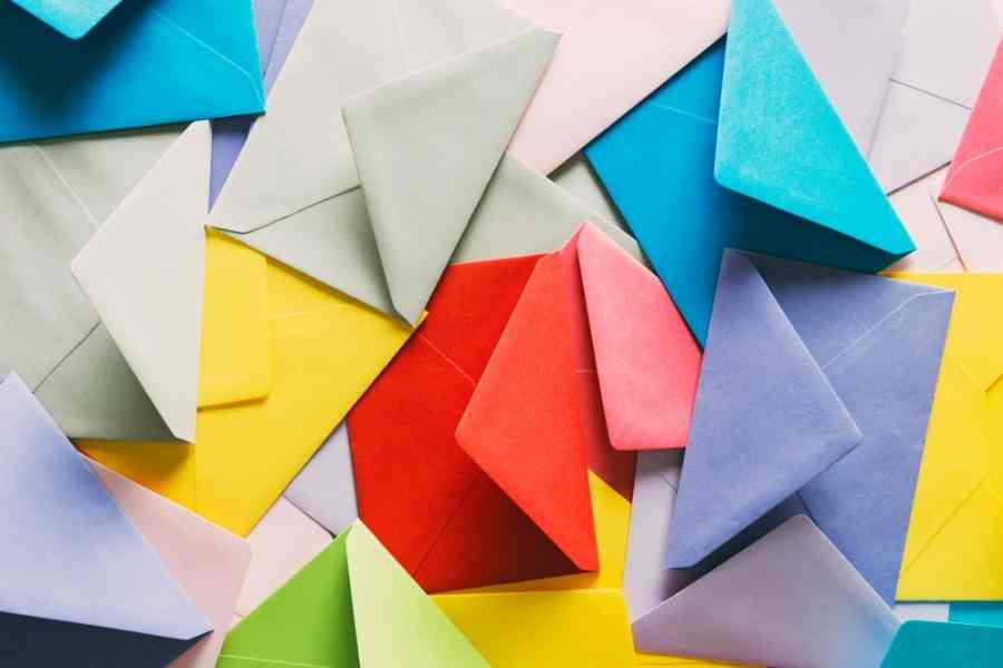 a pile of colored cash envelopes