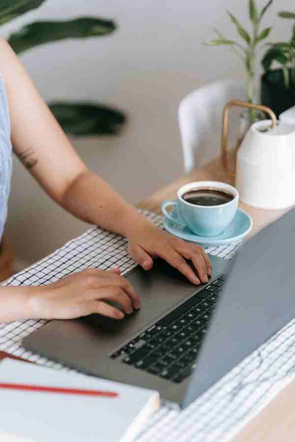 woman typing on a laptop