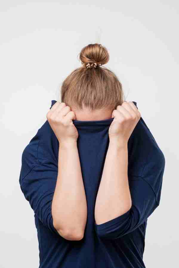 woman hiding face with sweater what are the best jobs for introverts